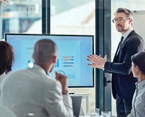 business people looking over data during meeting